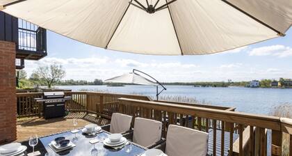Milly Cottage on the prestigious Lower Mill Estate is a lovely 5-bedroom lakeside retreat overlookin