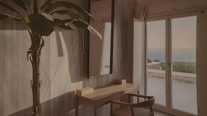 Une salle de bain moderne avec un meuble-lavabo en bois, un grand miroir et une vue sur l’extérieur.