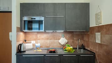 Appartamento (1 Bedroom) | Cucina privata | Microonde, piano cottura, lavastoviglie, macchina per caffè espresso