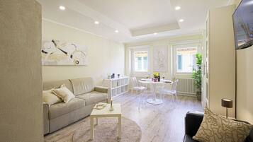 Apartment (1 Bedroom) | Living area | 32-inch TV with cable channels