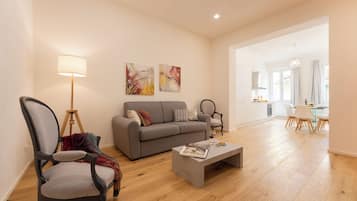 Apartment (3 Bedrooms) | Living area | 32-inch Smart TV with cable channels