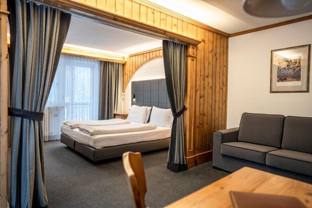 Camera Comfort con letto matrimoniale o 2 letti singoli | Una cassaforte in camera, una scrivania, tende oscuranti, Wi-Fi gratuito