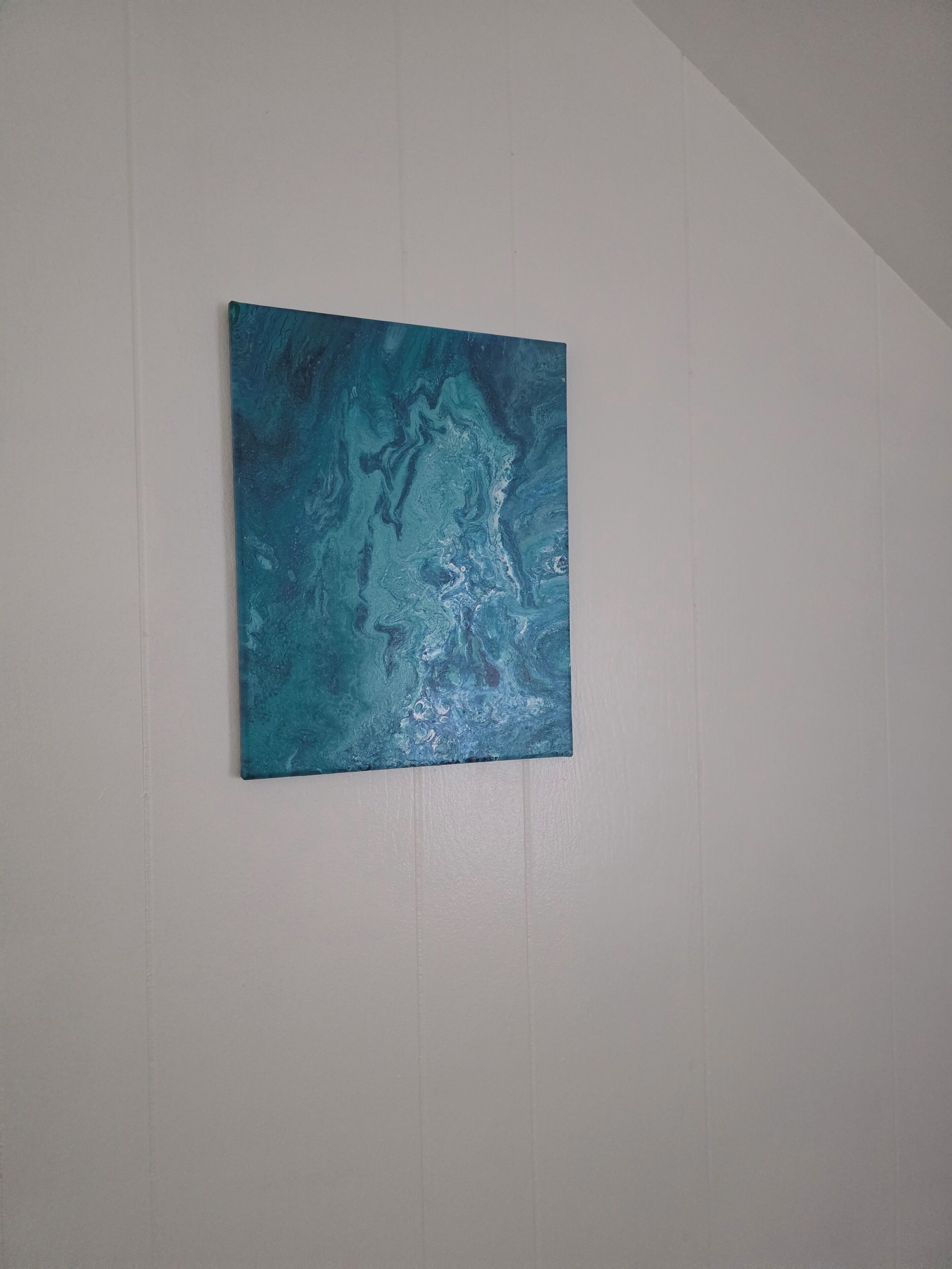 A painting on a plain wall.