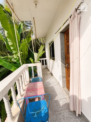 Comfort Apartment | Balcony - Bhumika by evaddo stays (Ashvem)