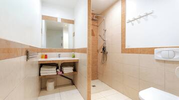 Shower, hair dryer, towels, soap