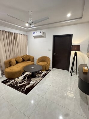 Living area - Light & Latte | 1BHK | MM ALAM | GULBERG | Self Check-In (Lahore)