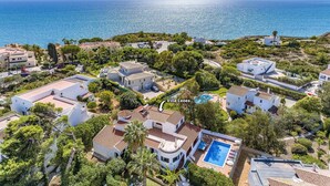 An aerial view of Villa Leoes with a swimming pool, surrounded by lush greenery and Mediterranean architecture. - Villa Leoes by Villa Plus (Carvoeiro)