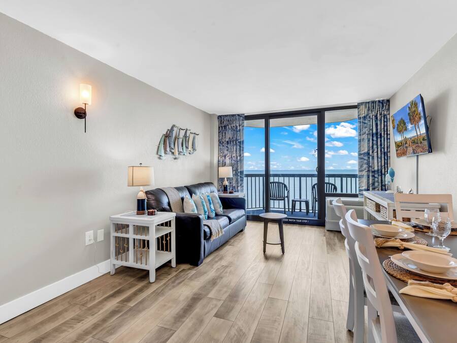 Signature Condo, 1 Bedroom, Balcony, Beach View | Living room | 32-inch Smart TV with digital channels
