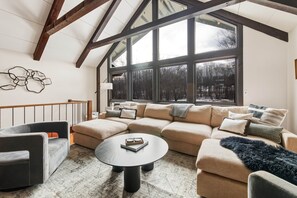 Spacious living room with vaulted ceilings and cozy fireplace - The Manor on the Ridge | Mt Snow 5 Min · Hot Tub (Dover)