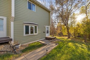 A residential house with a front porch, a small deck, and a pathway leading to the entrance. - 2 bedroom, 1 bath, townhome, west rapid location (Rapid City)