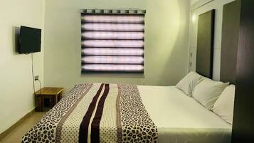 Deluxe Room, Balcony, City View | Desk, laptop workspace, blackout drapes, soundproofing