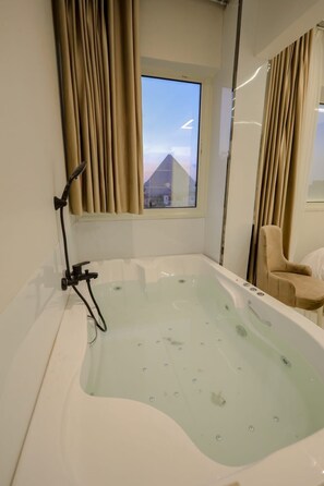 Shower, jetted tub, bidet, towels - First site of pyramids view hotel (Giza Governorate)