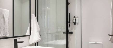 Shower, hair dryer, towels, shampoo