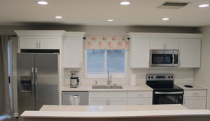 Fridge, microwave, oven, stovetop - Spacious 2-Bedroom Guesthouse Suite – Central KC Location, Family Friendly (Overland Park)