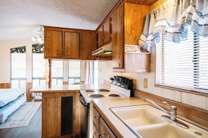 Comfort Cottage | Private kitchen | Full-size fridge, stovetop, cookware/dishes/utensils - Black Meadow Landing (Parker Dam)
