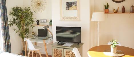 1 bedroom, desk, iron/ironing board, travel crib