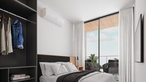 A modern bedroom with a large bed, a wardrobe, and a balcony with outdoor furniture. - PORTO 2 LIFE GAV- MARÉ ALTA (Ipojuca)