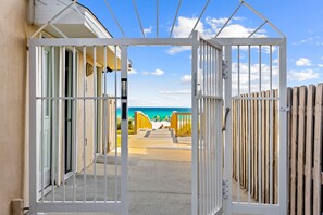 A gated entrance leading to a beach with a clear view of the ocean. - Beach House · Private Beach · Private Pool & Backyard · Steps to Sand (Miramar Beach)
