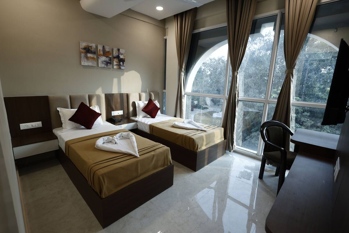 Deluxe Twin Room, City View | Memory foam beds, desk, laptop workspace, blackout drapes