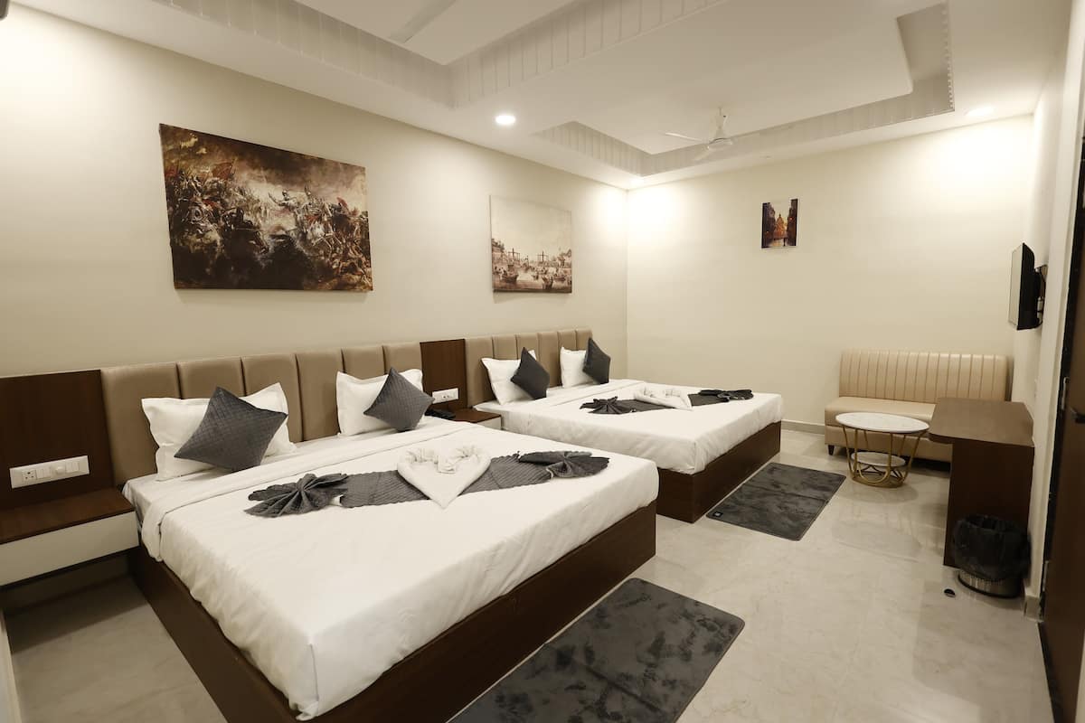 Family Quadruple Room | Memory foam beds, desk, laptop workspace, blackout drapes
