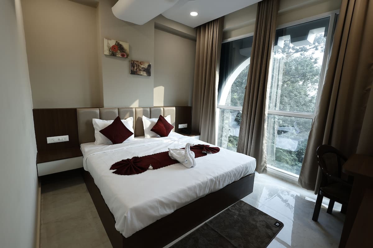 Deluxe Double Room, City View | Memory foam beds, desk, laptop workspace, blackout drapes
