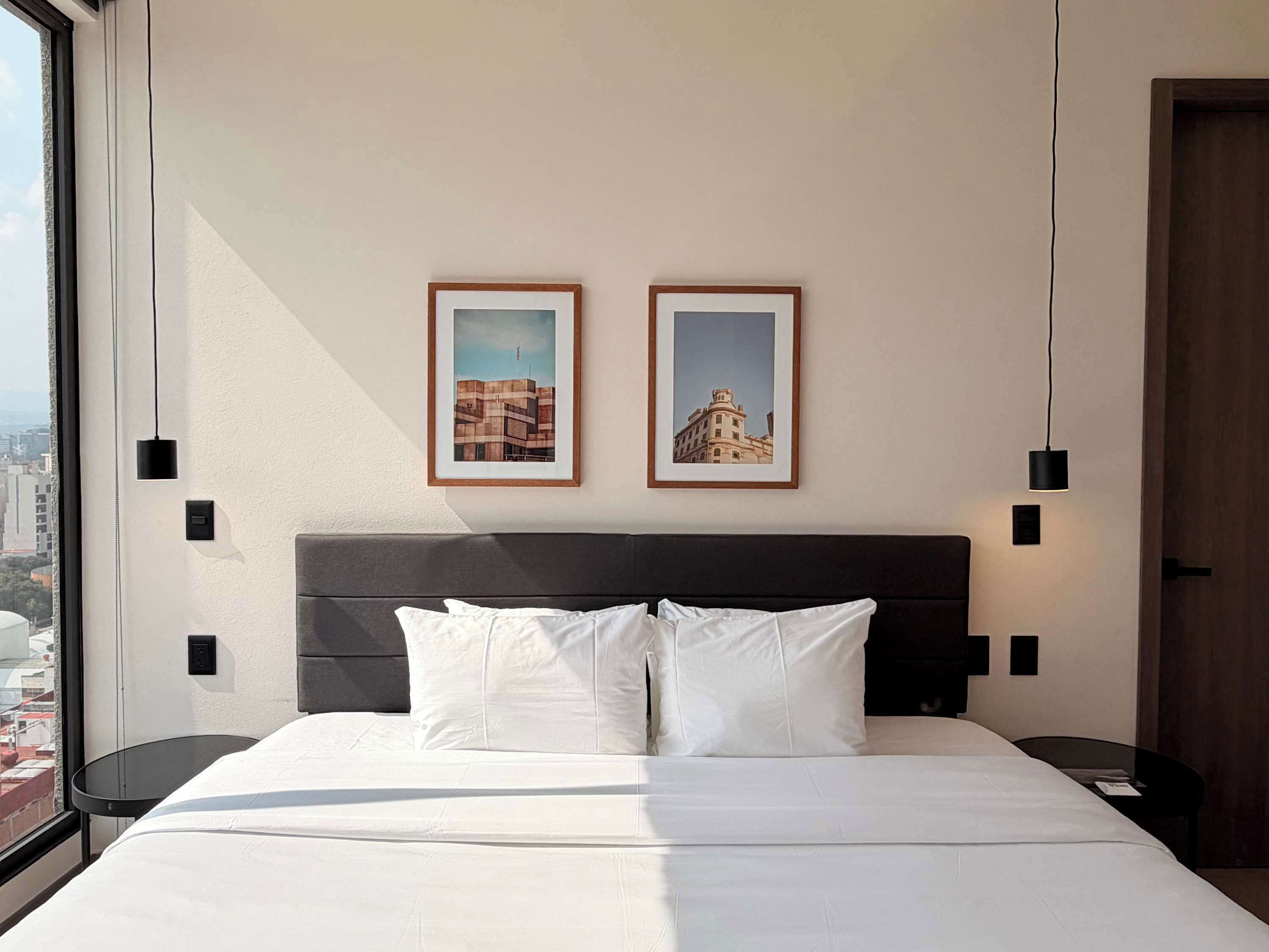 Comfortable bed with modern details designed for restful nights.