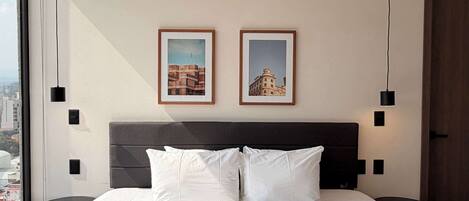 Comfortable bed with modern details designed for restful nights.