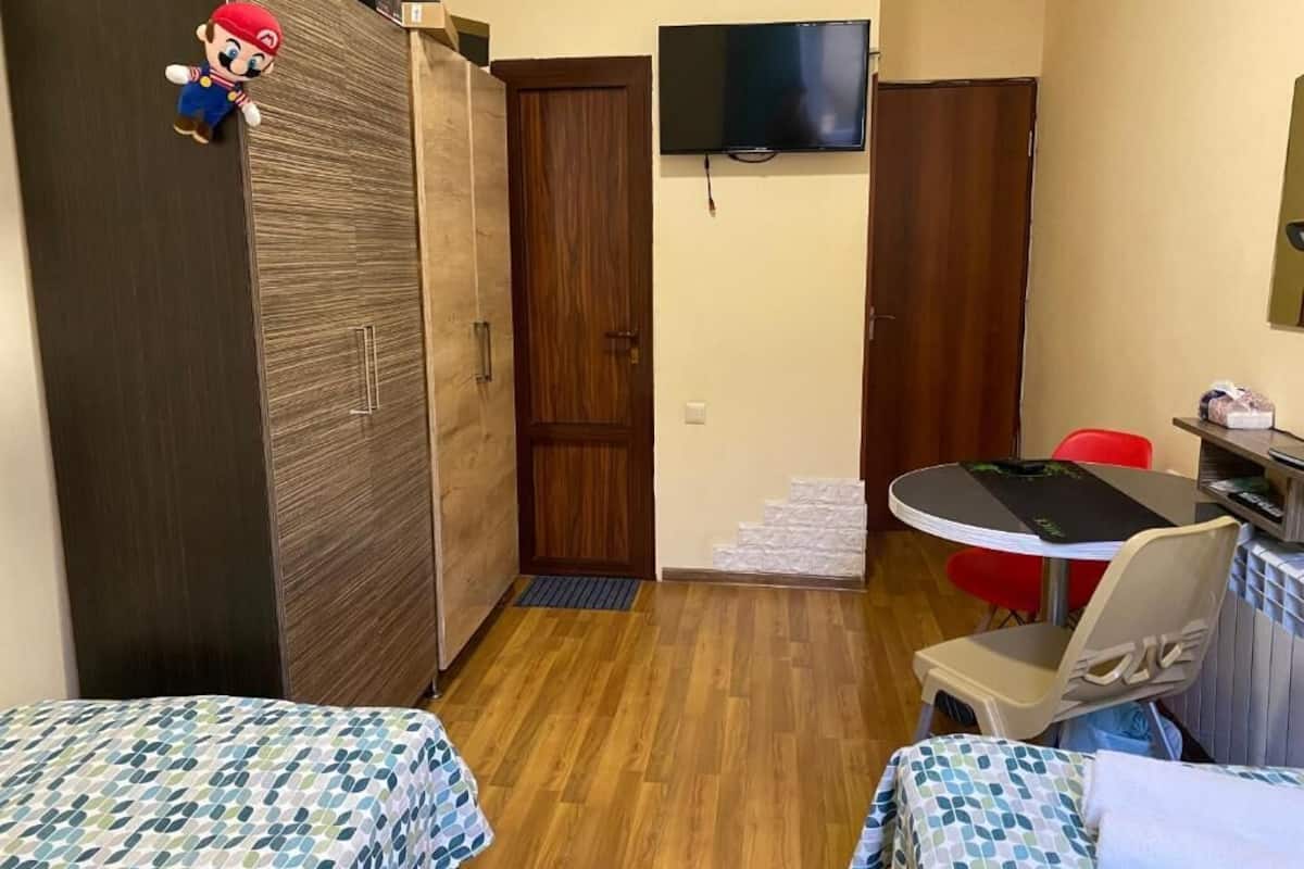 Twin Room, Courtyard View | In-room safe, soundproofing, iron/ironing board, free WiFi