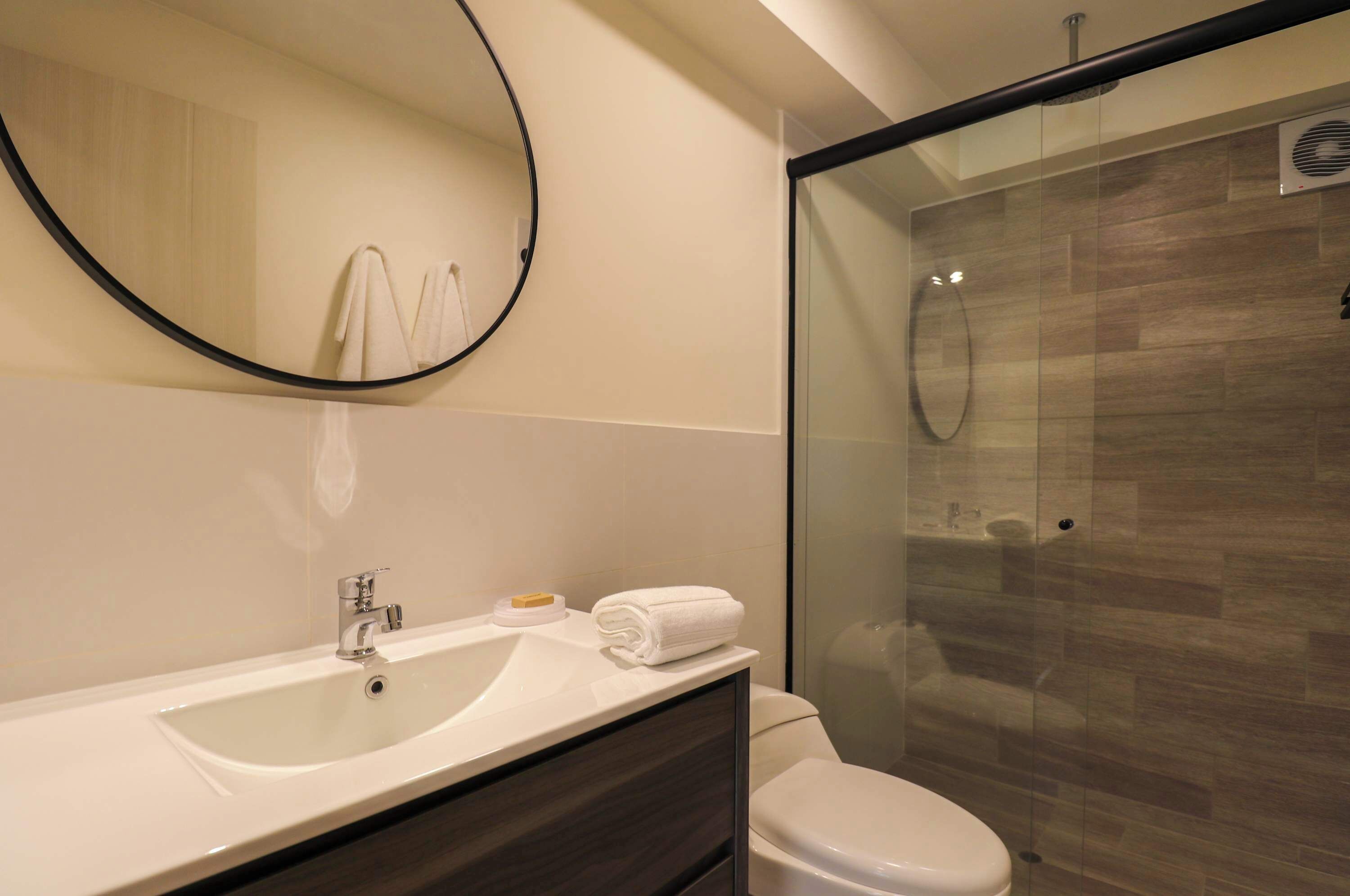 Shower, hair dryer, towels, shampoo