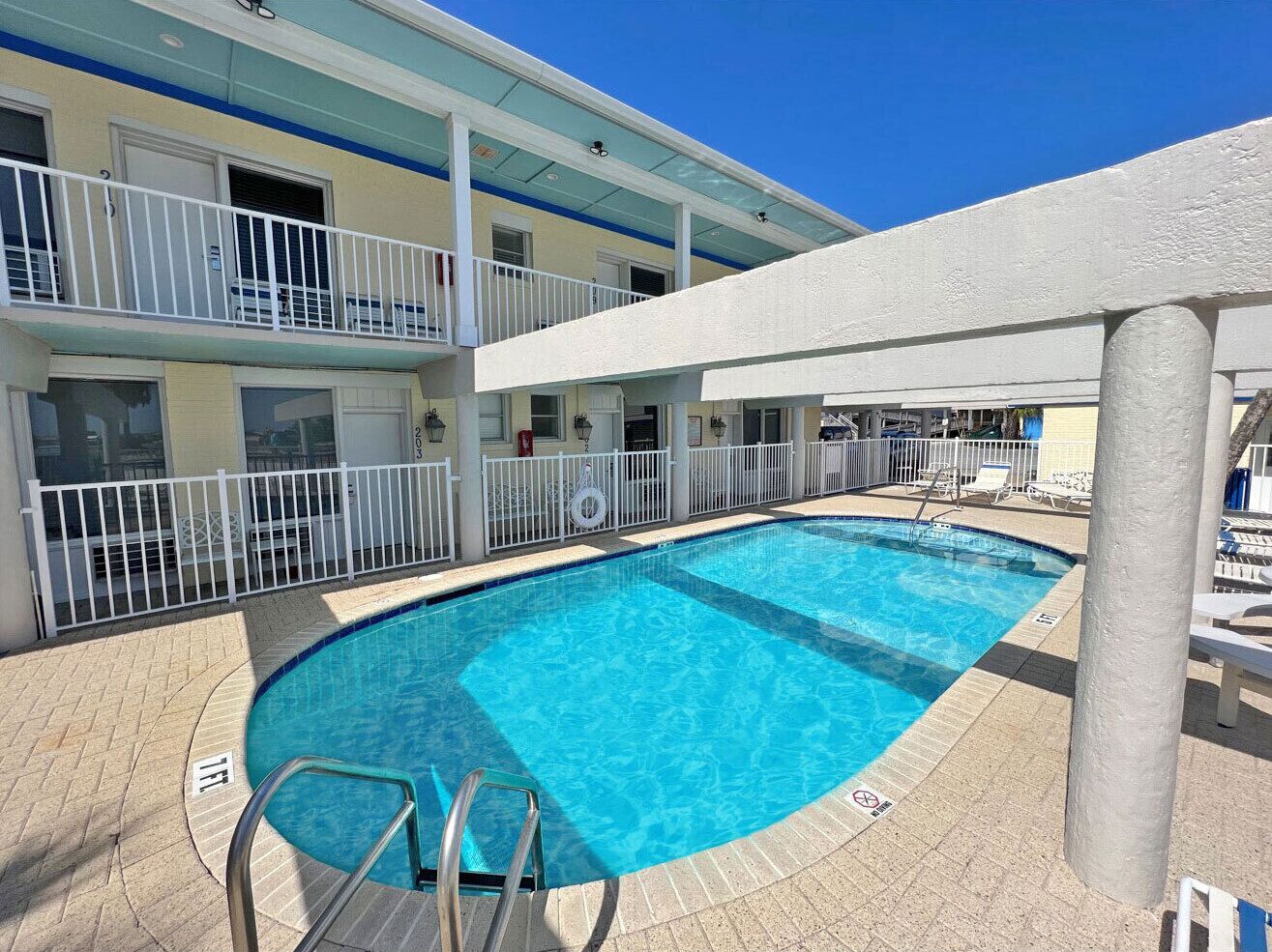 Outdoor pool, open 9:30 AM to 10:00 PM, pool umbrellas, pool loungers