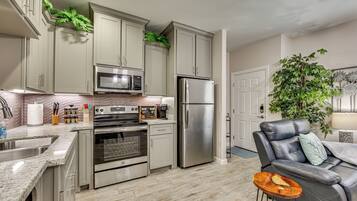 Fridge, microwave, stovetop, coffee/tea maker