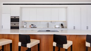 Penthouse, 2 Bedrooms (+ den) | Living area | 65-inch Smart TV with digital channels