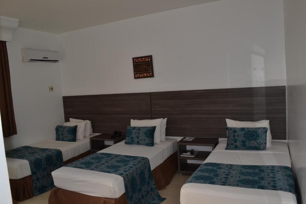 Kamar Triple Deluks, pemandangan kebun | Setrika/meja setrika, Wi-Fi gratis, dan dapat diakses tamu berkursi roda