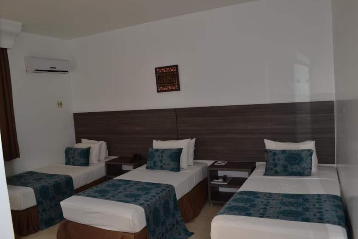 Deluxe Triple Room, Garden View | Iron/ironing board, free WiFi