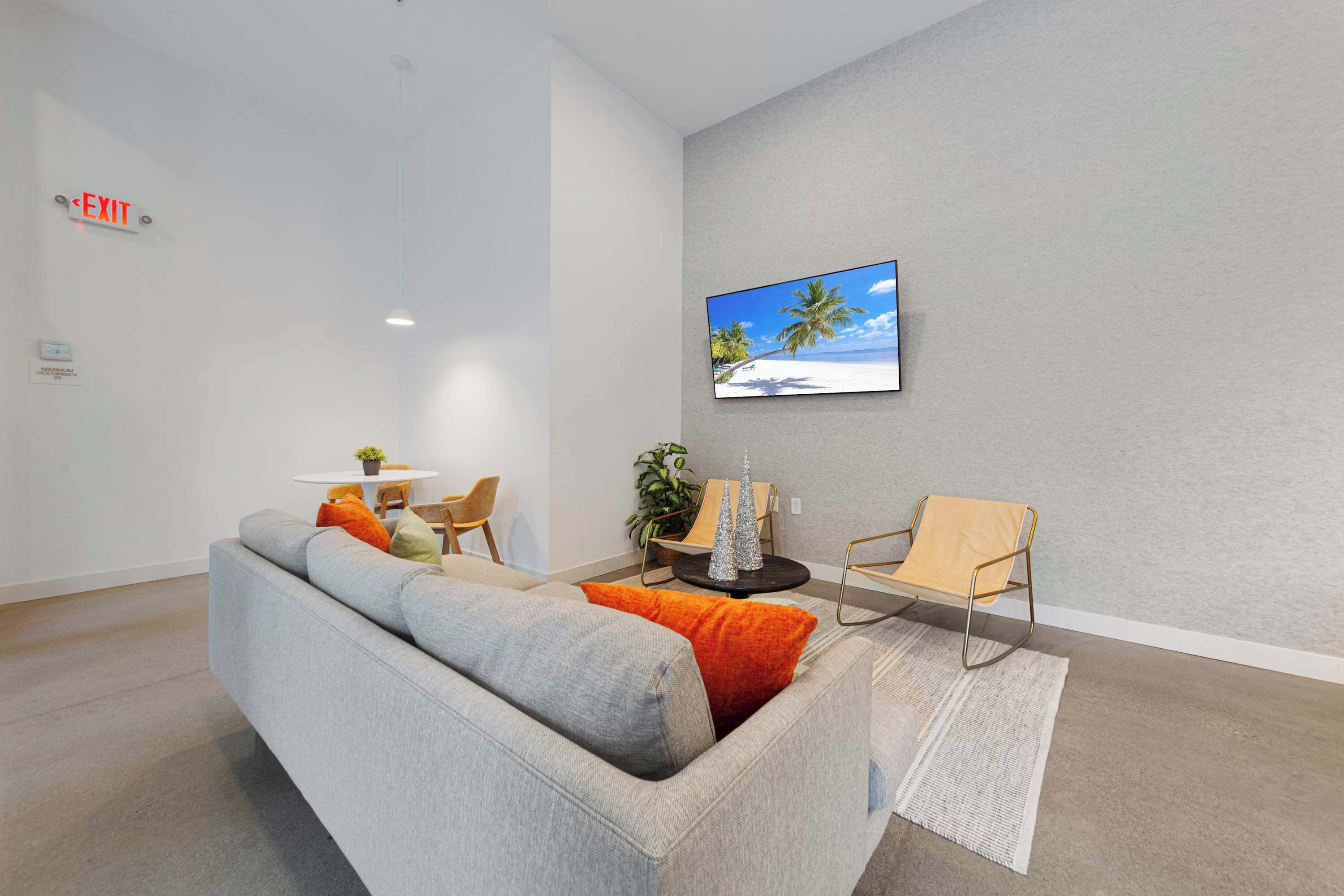 Another angle of the event room, showcasing its welcoming vibe and modern décor. The large windows let in plenty of natural light, making this space perfect for work, socializing, or hosting small events.