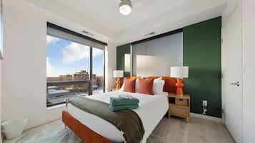 1 bedroom, desk, iron/ironing board, travel crib