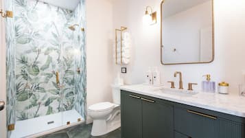 Shower, eco-friendly toiletries, hair dryer, towels