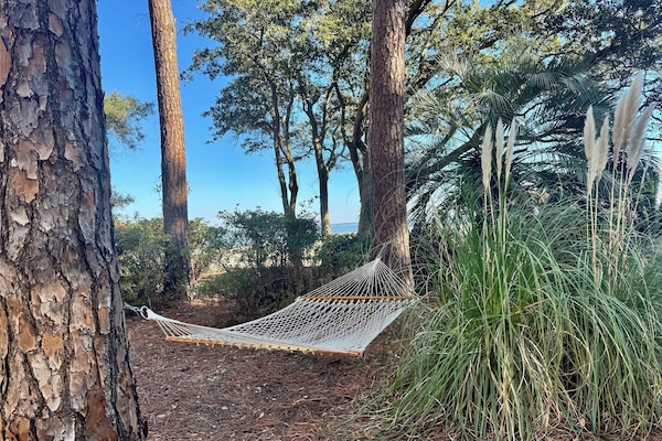 Hammocks on site just before beach entrance.