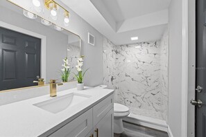 Shower, hair dryer, towels, toilet paper
