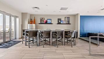 Stylish event lounge with bar seating ideal for gatherings and casual socials.