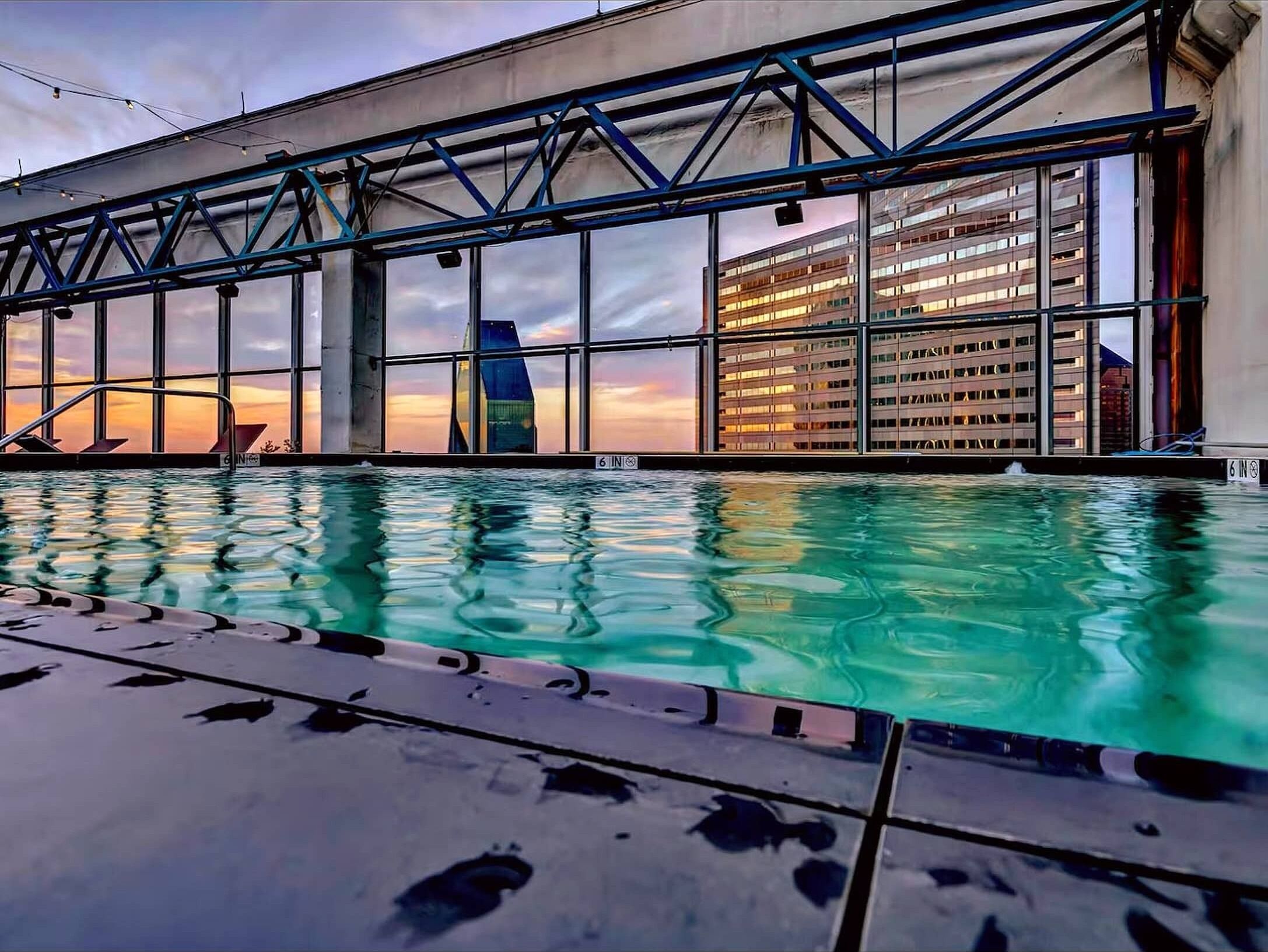 Relax at this stunning rooftop infinity pool, where calm waters mirror the glowing skyline at sunset. Framed by sweeping city views, it’s a serene escape perfect for unwinding, swimming, and soaking in unforgettable urban scenery. ✨🏙️🏊‍♂️