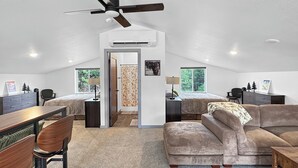 A spacious loft with a high ceiling, two bedrooms, a dining area, and a living room. - New Black Hills Home Next to Wind Cave National Park (Custer)