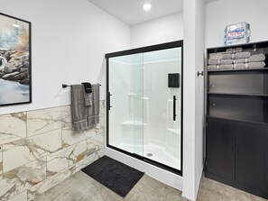Shower, hair dryer, towels, soap