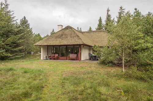 Holiday home with thatched roof and calm