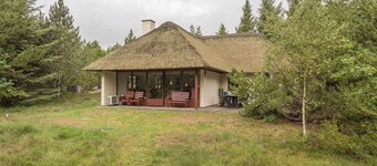 Holiday home with thatched roof and calm