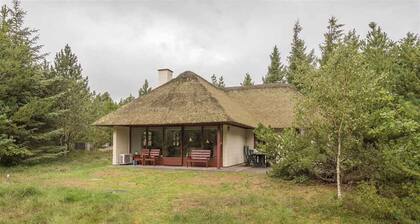Holiday home with thatched roof and calm