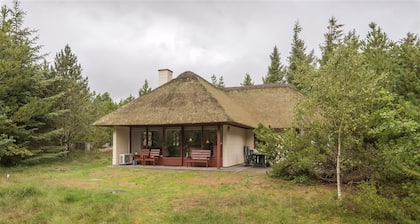 Holiday home with thatched roof and calm