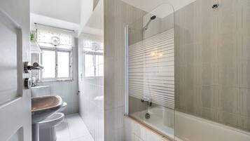 Shower, towels, soap, toilet paper