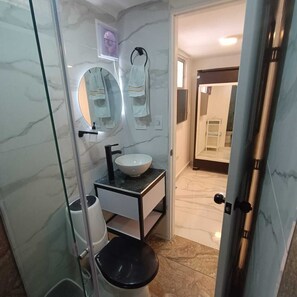 Shower, towels, soap, toilet paper