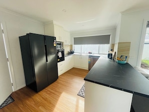 Quality appliances
Microwave
Double door fridge/freezer
Dishwasher
Induction cooktop
Smeg kettle and toaster
Saucepans
Chopping boards etc  - NEW 2 bed, 2 bath - spacious & stylish Cottage (Isabella Plains)